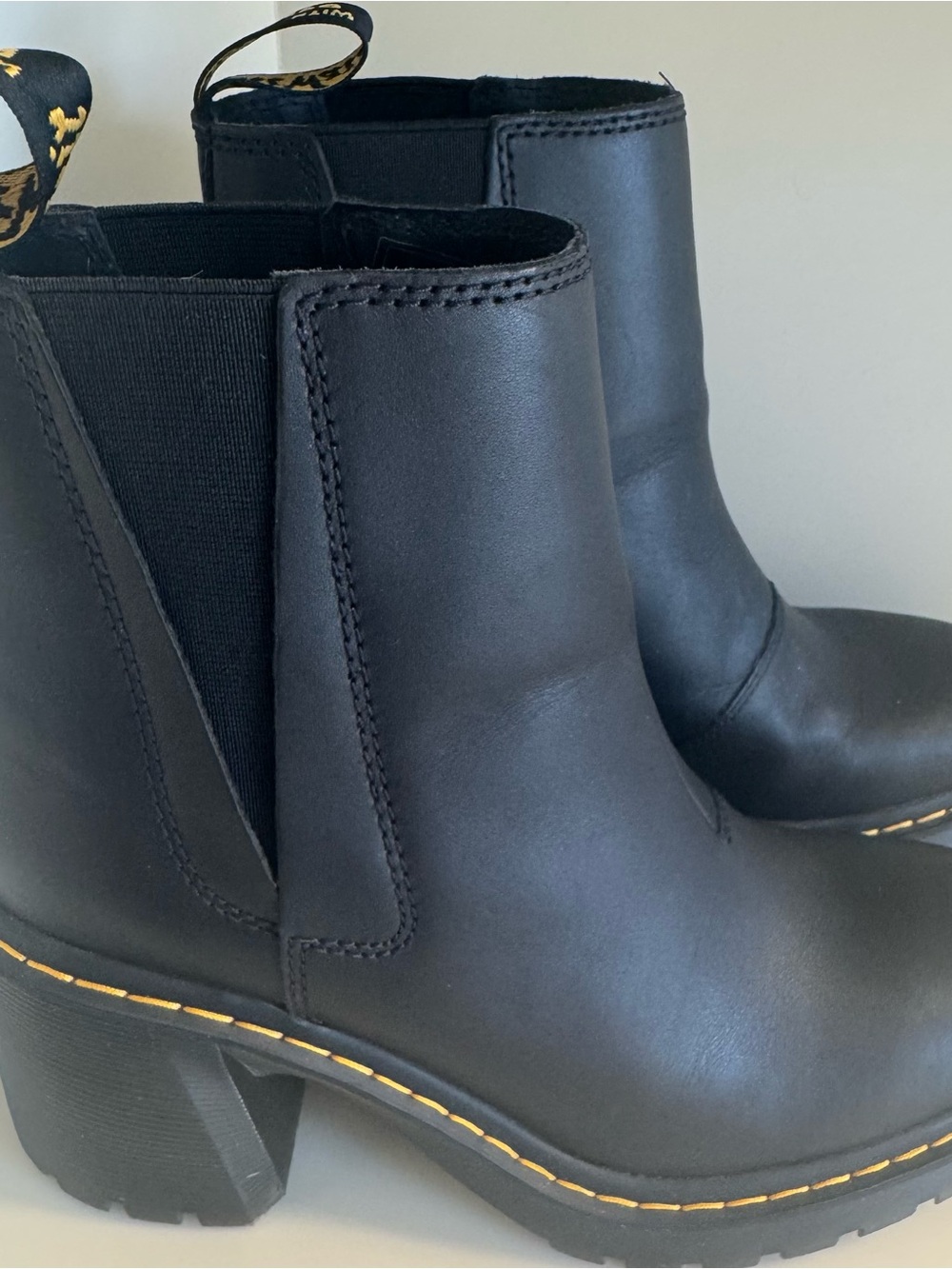 Dr. Martens Black Leather Heeled Chelsea Booties with Yellow Stitching